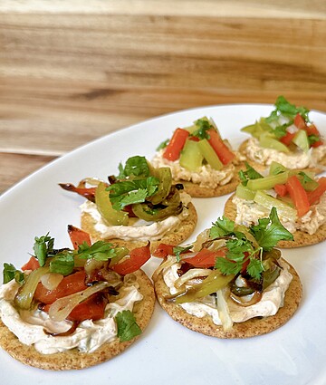 Colorful vegetable-topped crackers appetizers for delightful gatherings and casual dining experiences.
