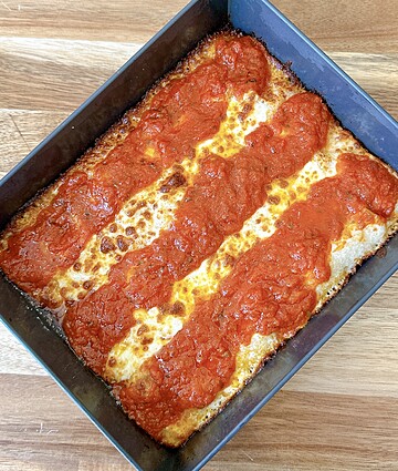 Mouthwatering baked pasta casserole topped with melty cheese and rich tomato sauce.