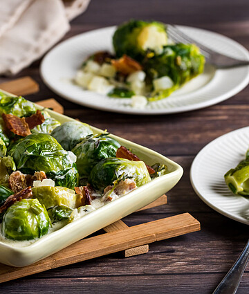 Savory Brussels sprouts with crispy bacon in a creamy lemon sauce, perfect for any occasion.