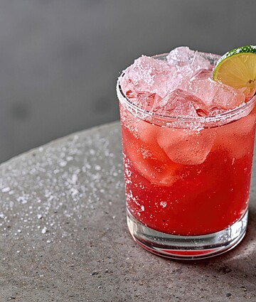 Frozen Homemade Summer Cocktail With Strawberries And Lime On A Rustic Stone Surface, Space For Text.