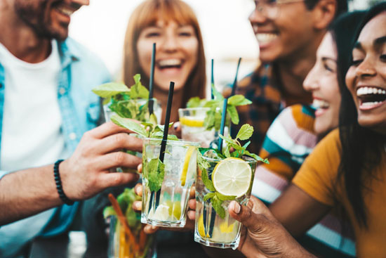 Multiracial Friends Enjoying Happy Hour Toasting Fresh Mojito Co